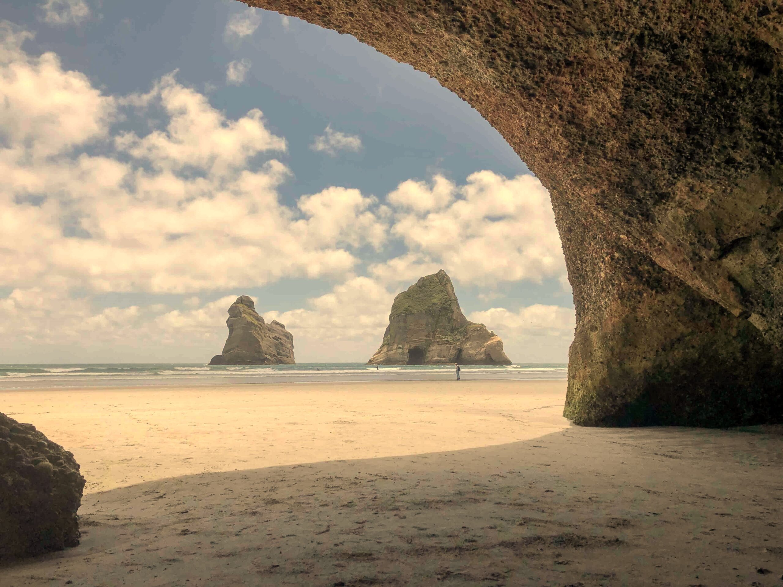 Archway Islands viewed from inside a cave at Wharariki Beach, Golden Bay, New Zealand.