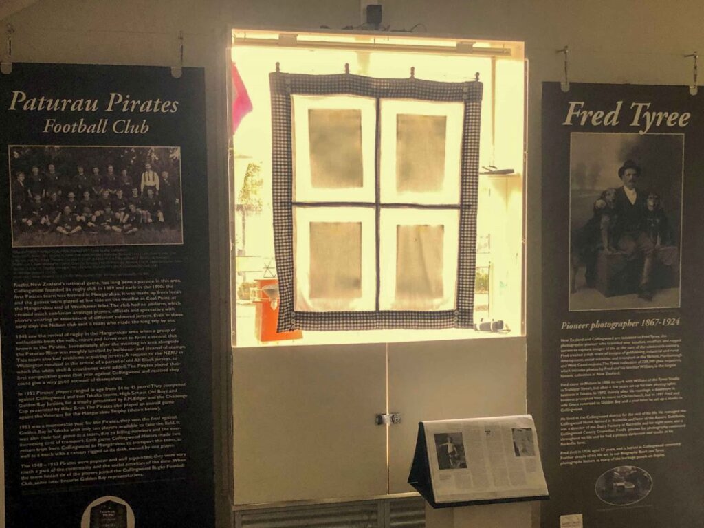 Historic display featuring Paturau Pirates Football Club and pioneer photographer Fred Tyree at a Golden Bay museum exhibit in Collingwood, New Zealand.