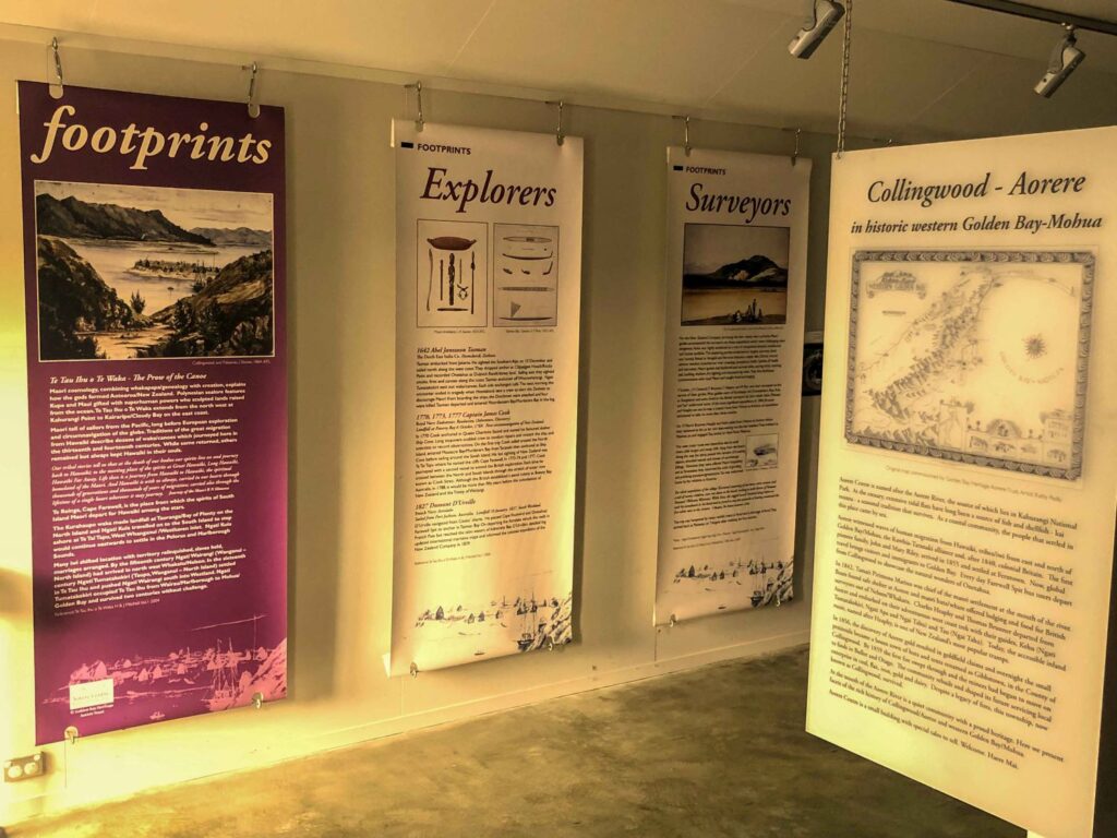 Exhibition panels on early exploration, surveying, and settlement history at the Aorere Centre in Collingwood, Golden Bay, New Zealand.