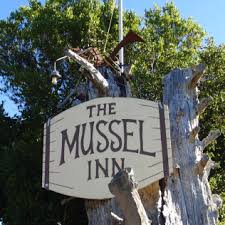 “The Mussel Inn sign in Golden Bay, New Zealand — a popular restaurant and bar only 10 minutes from The Station House Motel in Collingwood.”